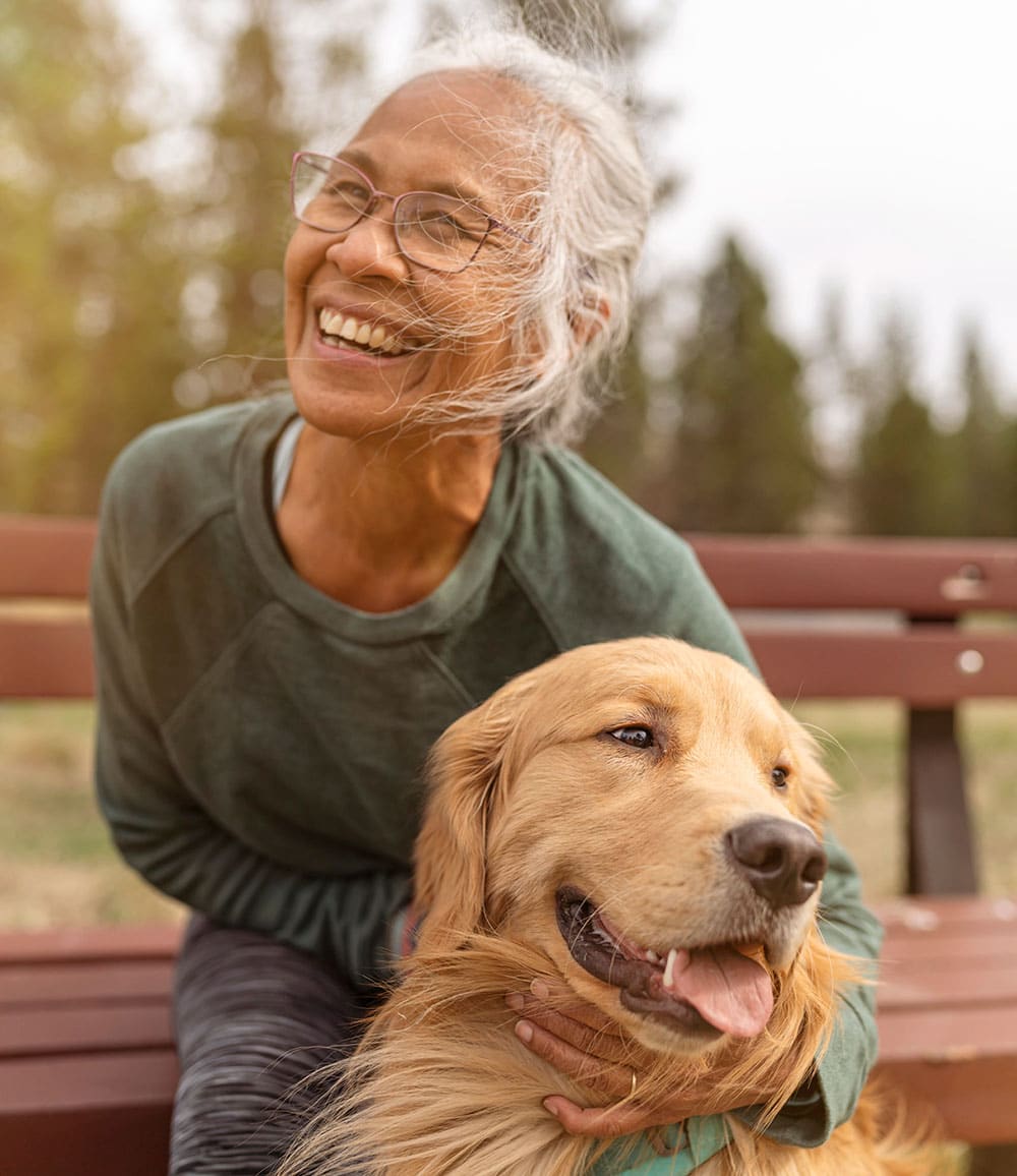 Happy Senior lady with dog